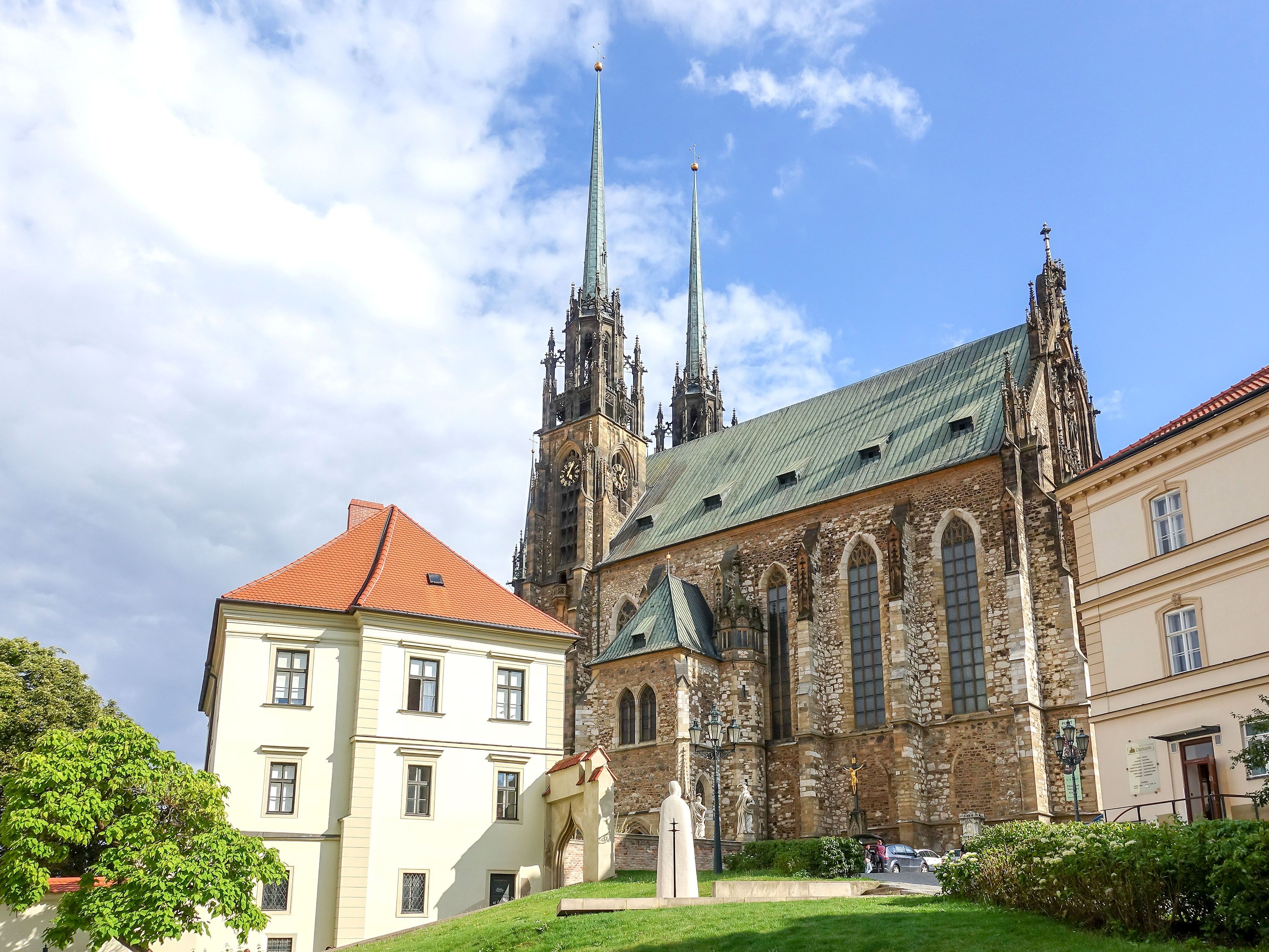 Church and buildings against blue sky.