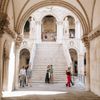 Visitors admire the Venetian Gothic architecture at the Doge’s Palace in Venice, Italy