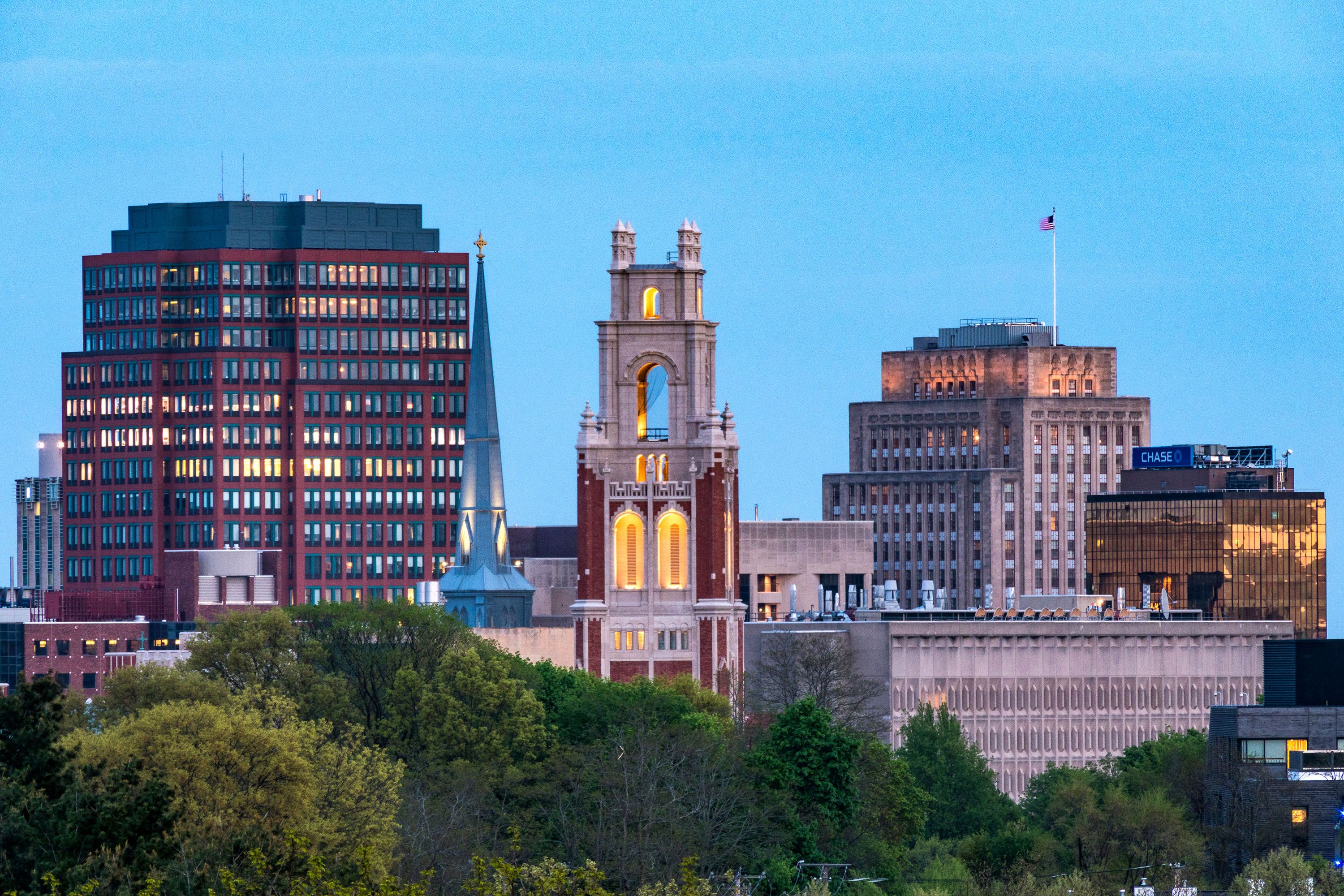 A city skyline at dusk.