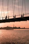 The CN Tower visible on the horizon below the Humber Bay Arch Bridge in Toronto, Canada