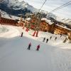 People ski beneath the Alpauris lift, nicknamed the "scare chair," in Alpe d'Huez in France