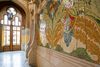 Close-up of colorful mosaic tile details decorating the interior walls of the Hospital de la Santa Creu i Sant Pau in Barcelona.