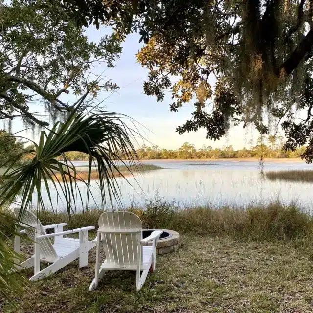 Two white loungers by the saltwater marsh on Tybee Island, Georgia
