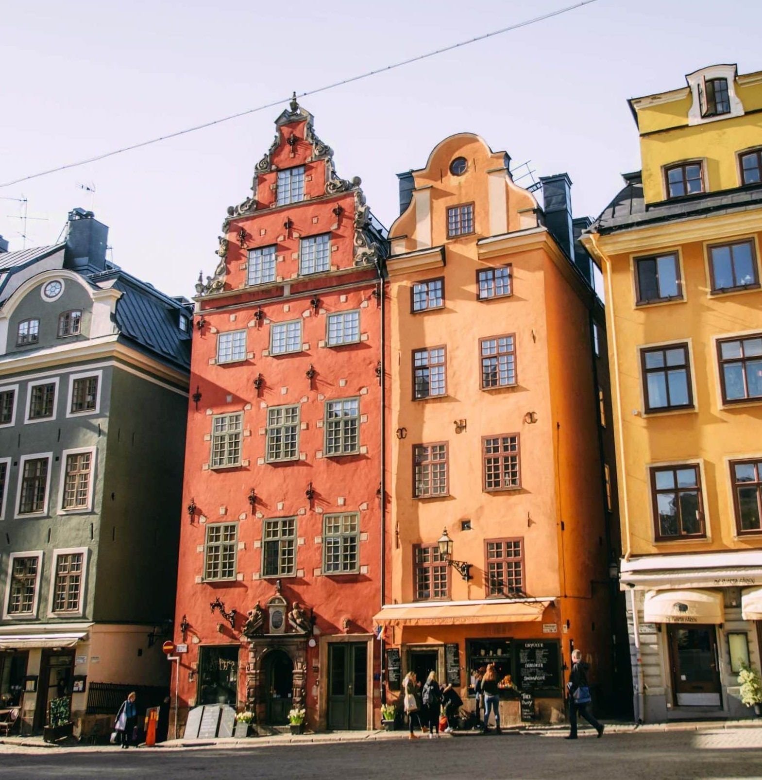 Stockholm's colorful buildings and storefronts in shades of yellow, orange, and green