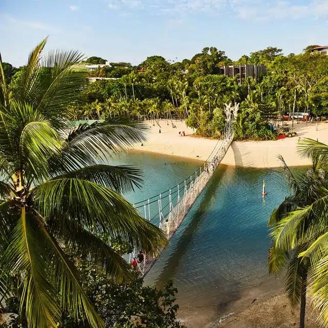 Palm trees, golden sands and blue waters are seen from a bird's eye view from the watch tower on Palawan Beach in Sentosa, Singapore
