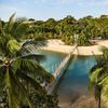 Palm trees, golden sands and blue waters are seen from a bird's eye view from the watch tower on Palawan Beach in Sentosa, Singapore