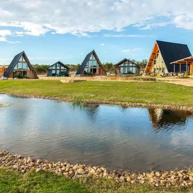 A-Frame cabin Vrbos below a blue sky in Texas