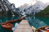 Boats on a lake by the Dolomites