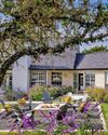 Adirondacks surround a fire pit beside a vast Vrbo near Austin, Texas