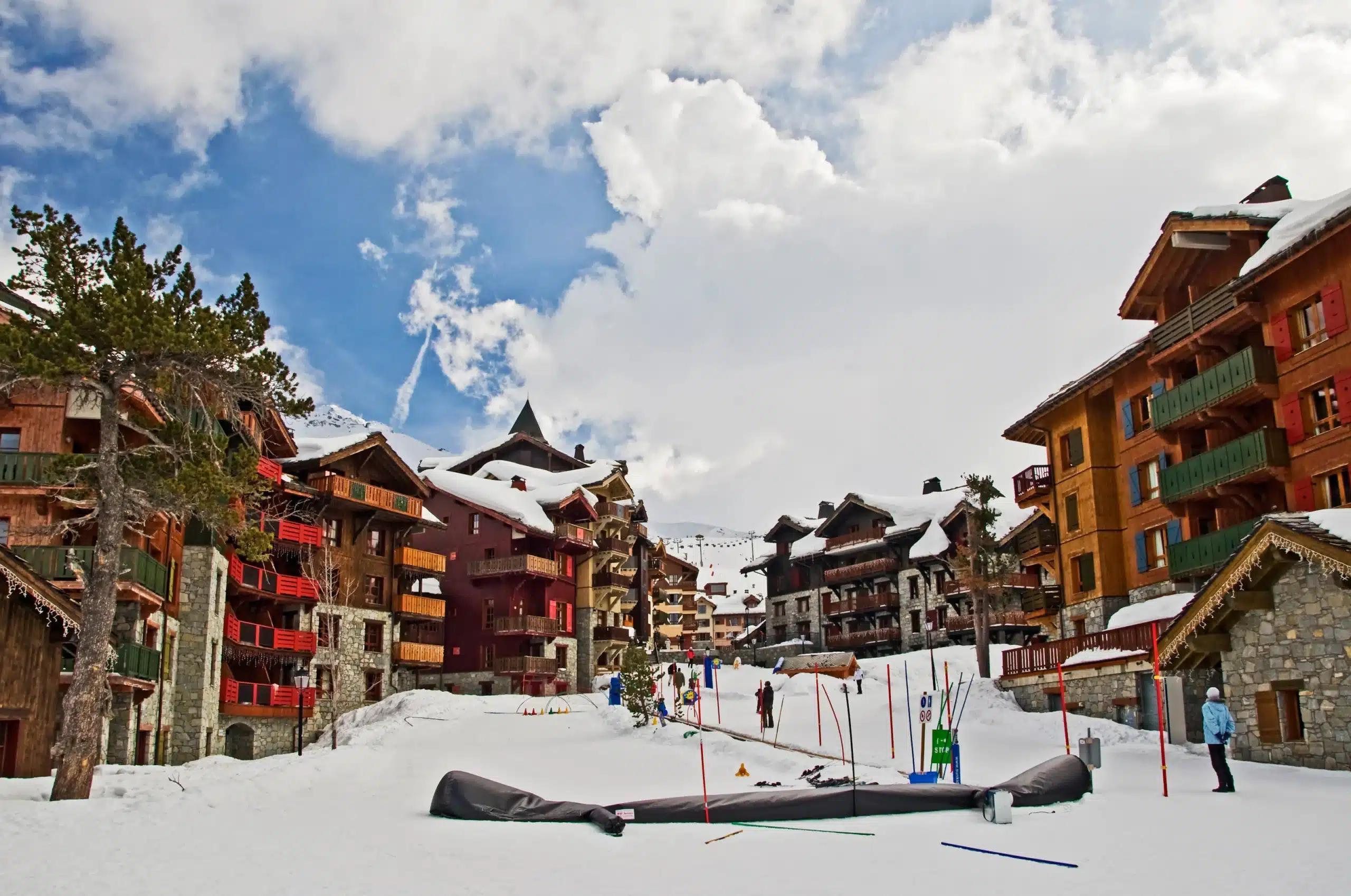 Brightly colored, snow-covered chalets in Les Arcs, France