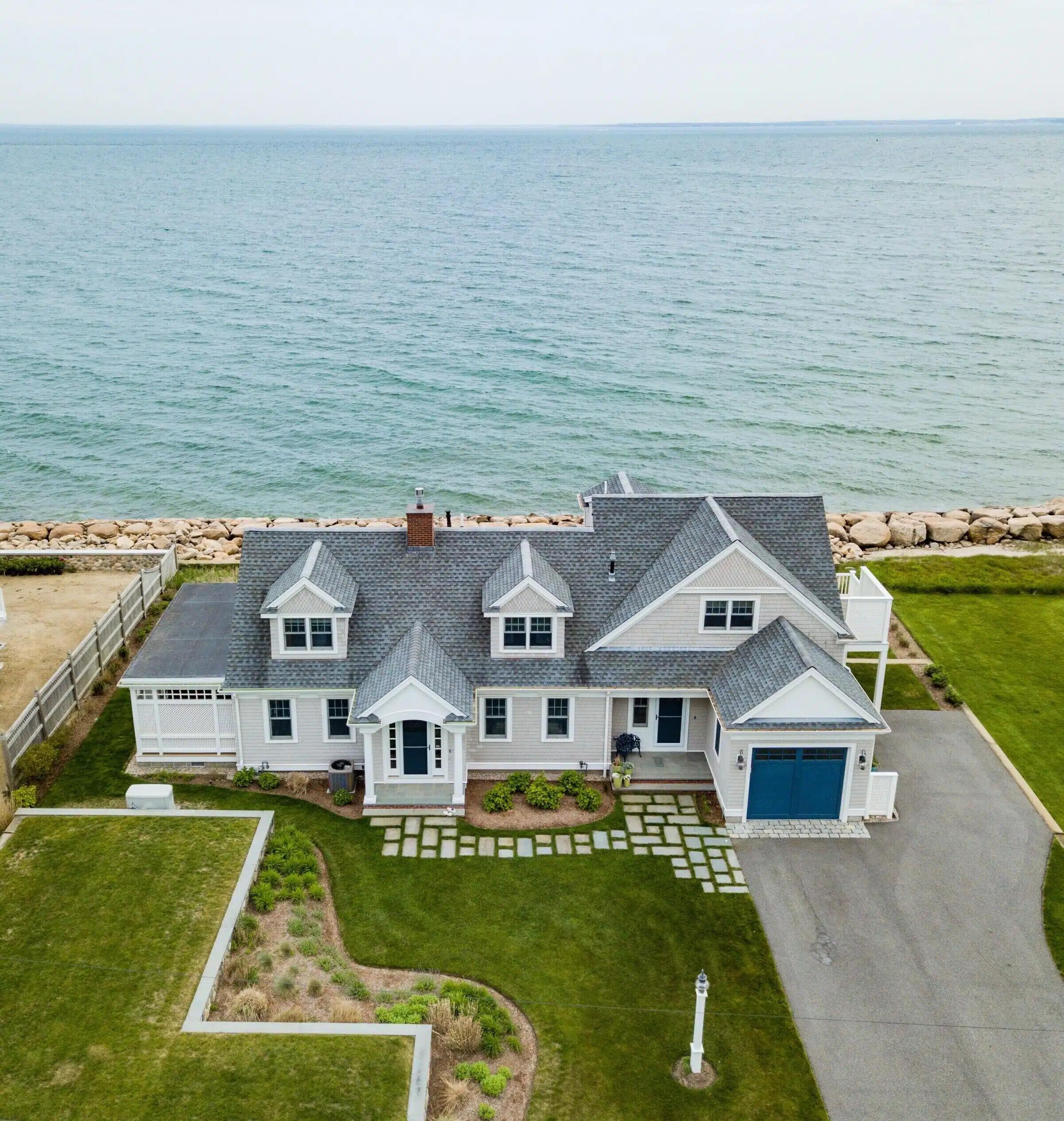A large Vrbo beside the sea, with pitched roof and lots of garden space