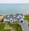 A large Vrbo beside the sea, with pitched roof and lots of garden space
