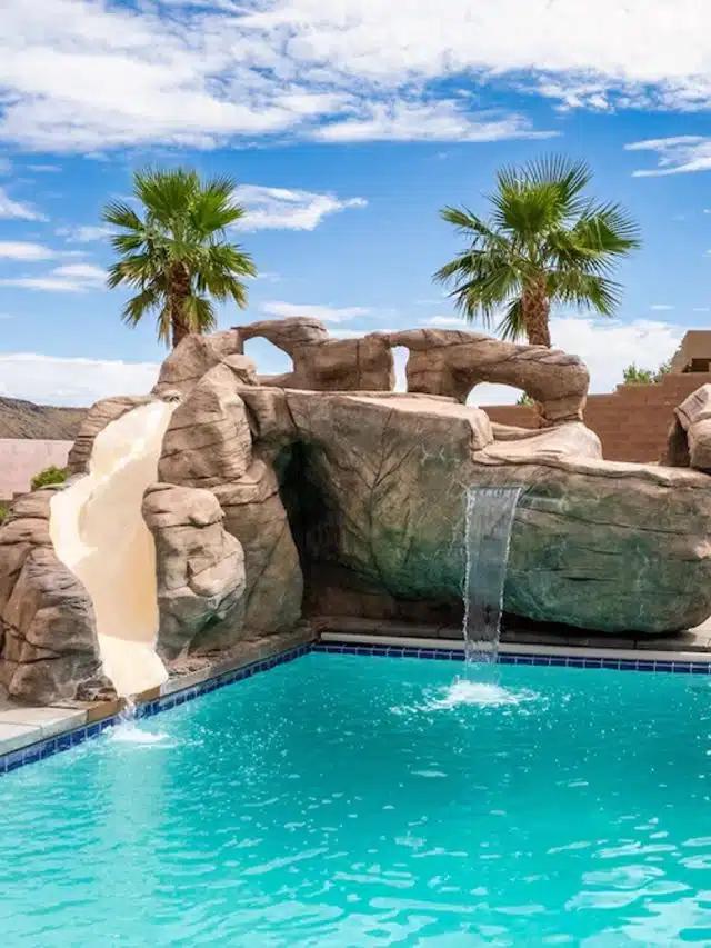 A rock feature with inbuilt slide beside a pool in Hurricane, Utah