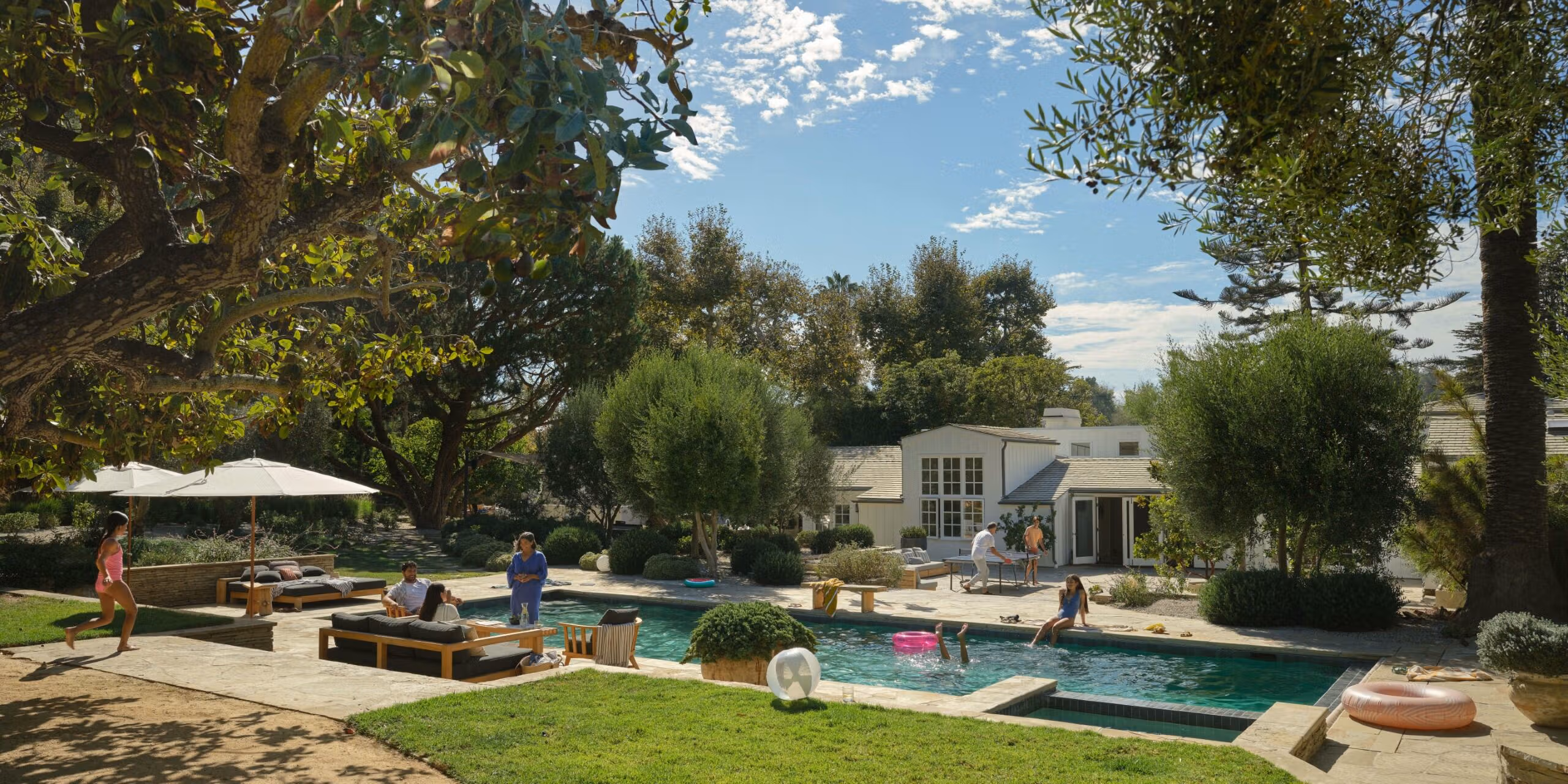 A family enjoying the garden amenities during a stay in a vacation rental