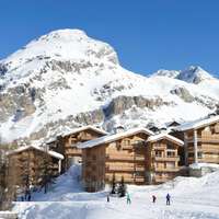Snow-covered chalets and mountains in Val-d’Isère
