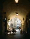 People dine alfresco at Arco di San Pierino in Florence, Italy