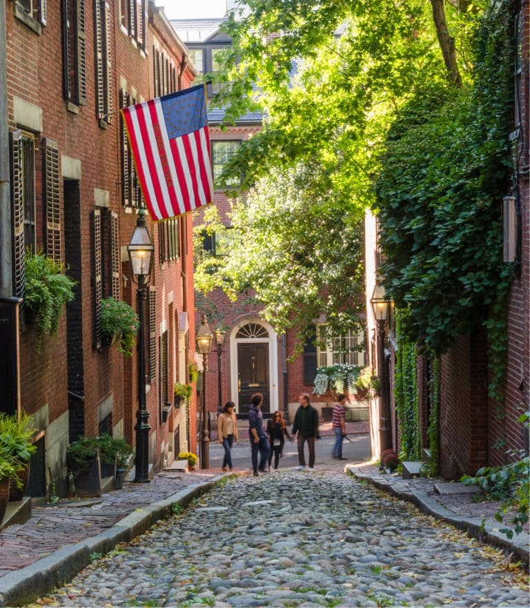 Boston's photogenic, cobblestoned Acorn Street, with a flag flying