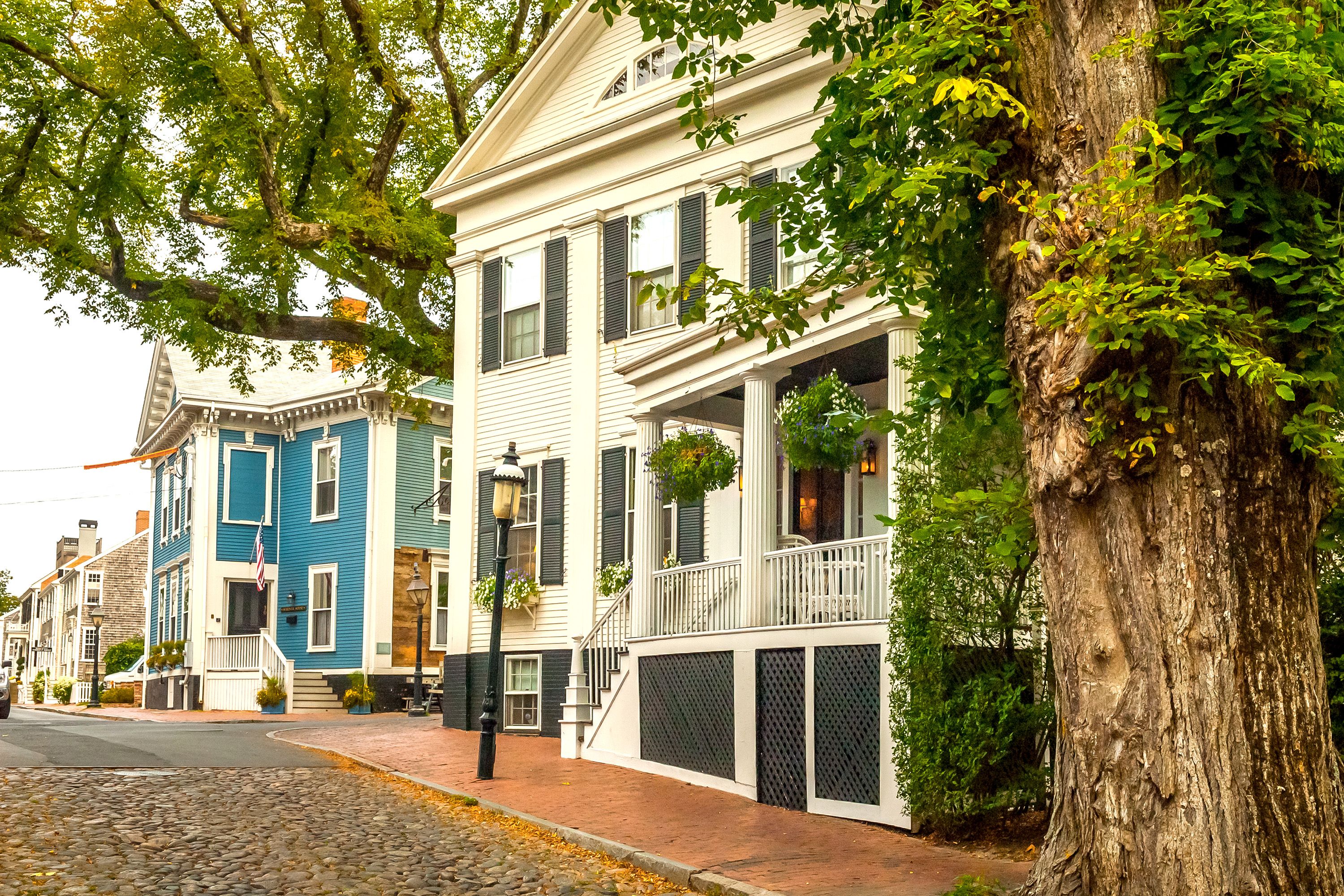 Colonial-style homes along a village street.