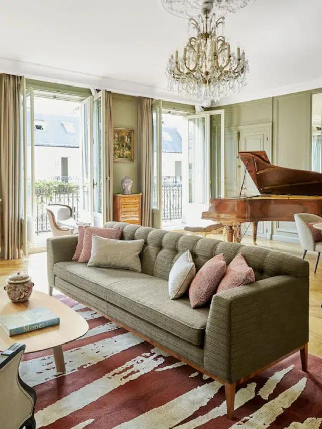 A grand piano and sofa in a suite at the Hotel Lancaster in Paris, France