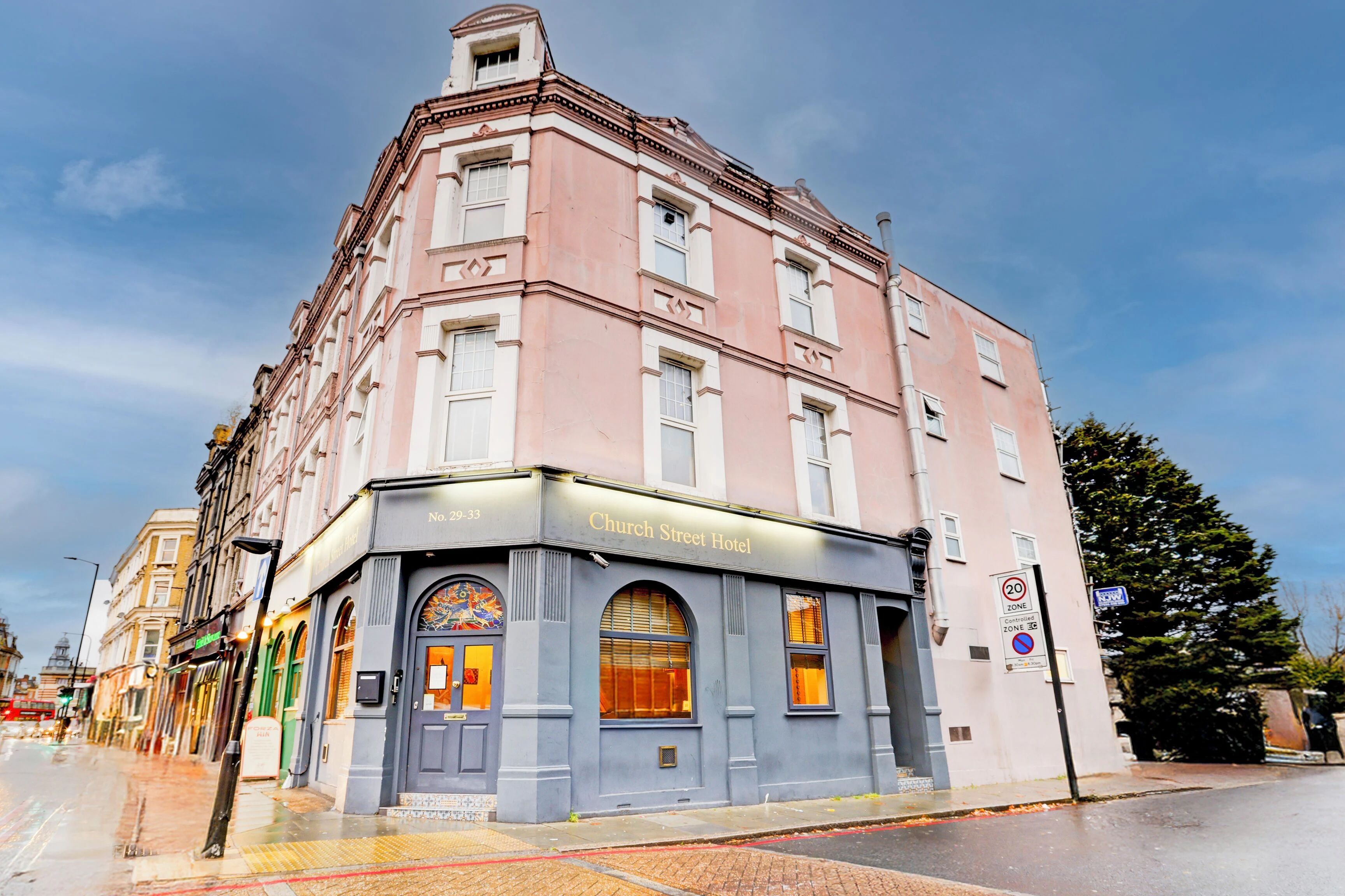 The pink facade of the Church Street Hotel in Peckham, London