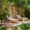 Sun loungers beside a pool in a garden of a Vrbo in Mérida, Mexico