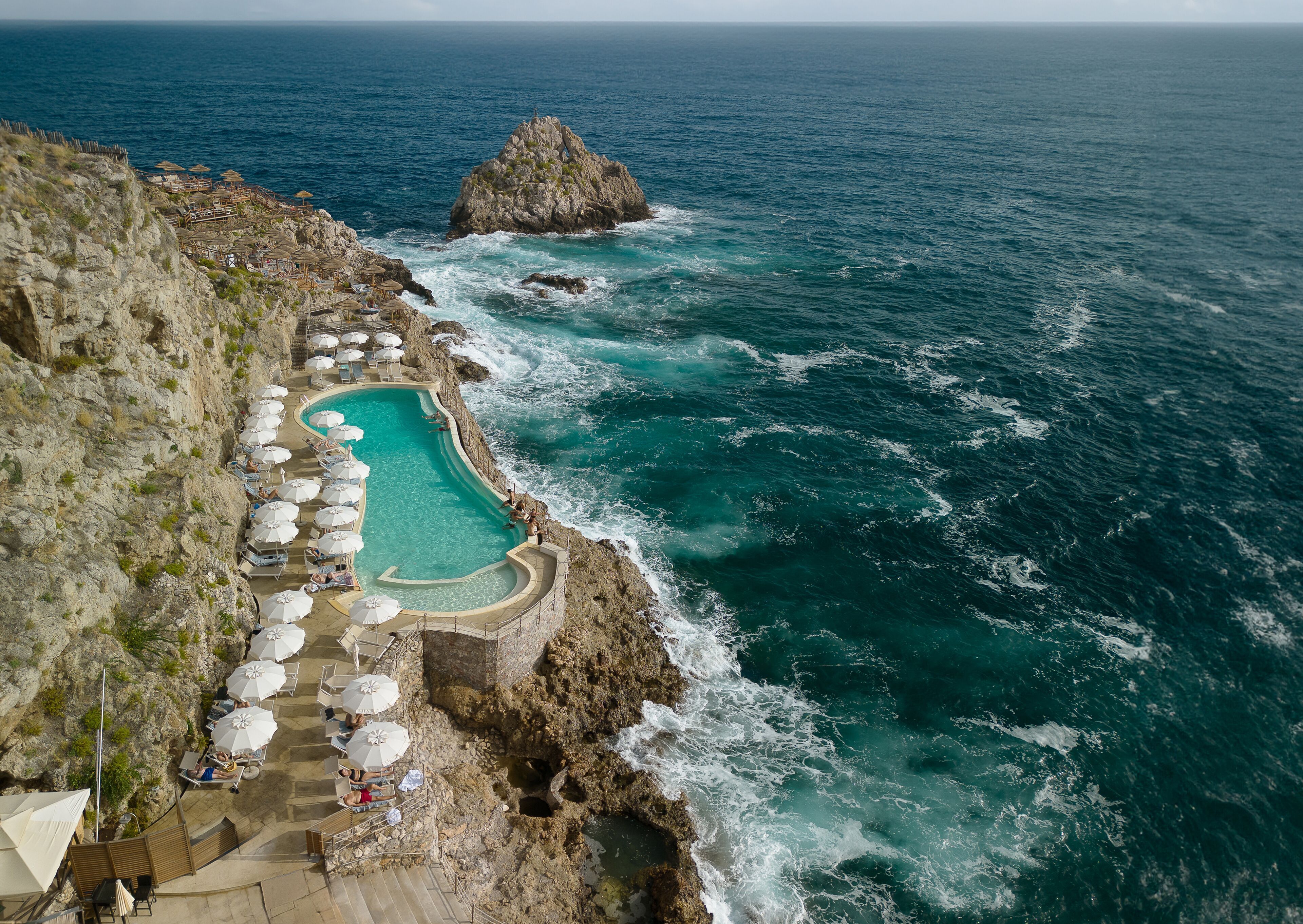 View of UNAHOTELS Capotaormina's private beach seen from above in Sicily