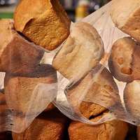 Bread stacked haphazardly on a cloth in the bazaar in Khorog, Tajikistan