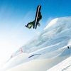 Shaun White performs a snowboard trick in the air on snow-covered slopes