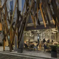 An abstract metal facade frames the dramatic entrance to ONE @ Tokyo hotel in Tokyo, Japan