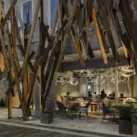 An abstract metal facade frames the dramatic entrance to ONE @ Tokyo hotel in Tokyo, Japan