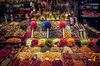 Colorful treats and snacks at a vendor booth in La Boqueria, Barcelona.