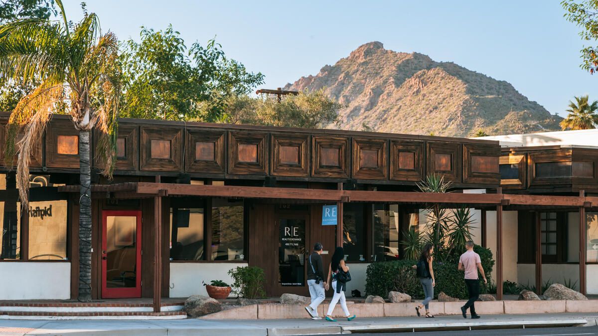 Strolling through Old Town South Scottsdale with a stunning mountain backdrop in Scottsdale, Arizona