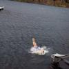 Ewan McGregor splashes into a loch from a metal slide, Taymouth Marina, Scotland