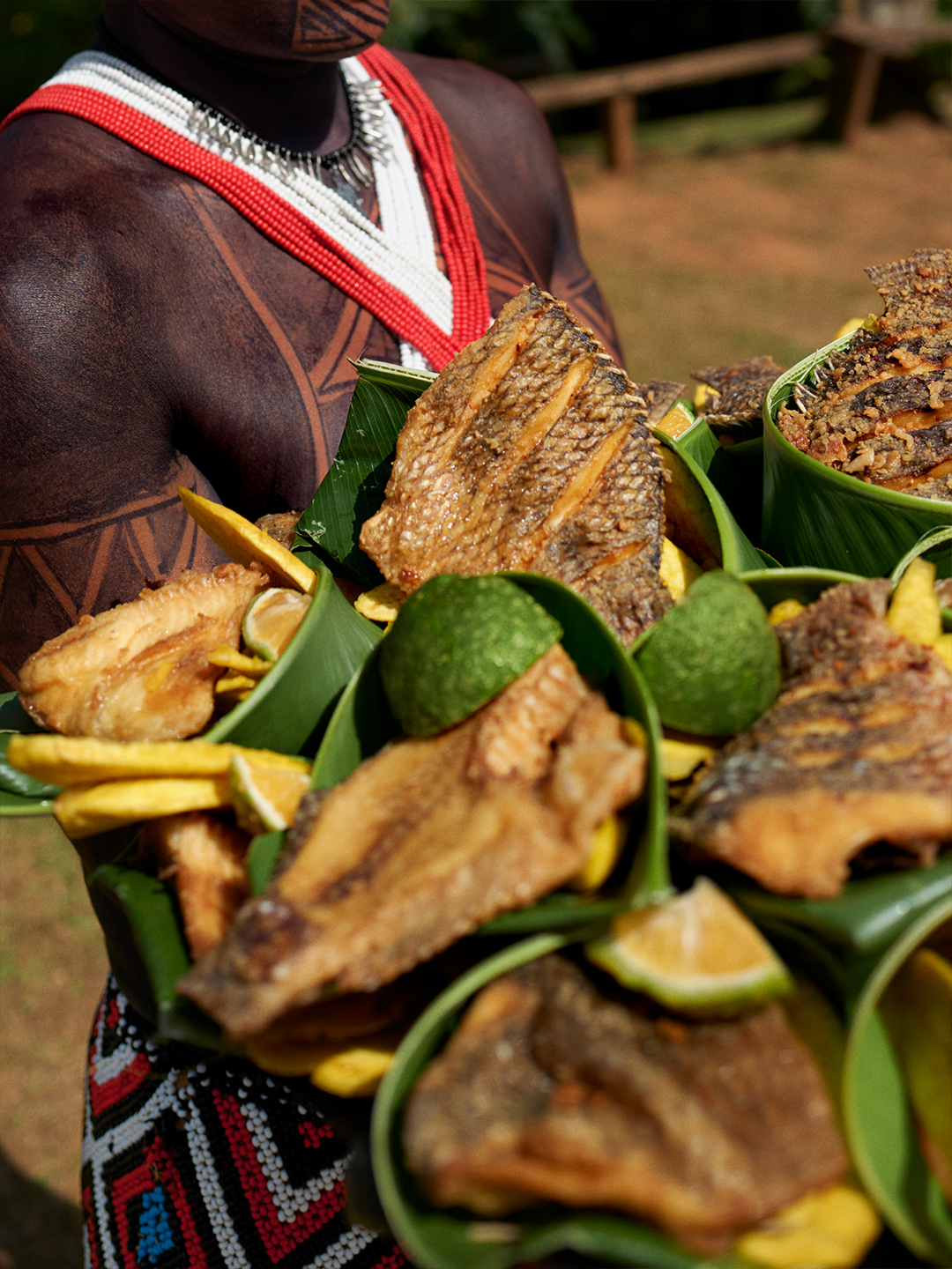 A person holds plates filled with panamanian food