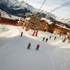 People ski beneath the Alpauris lift, nicknamed the "scare chair," in Alpe d'Huez in France
