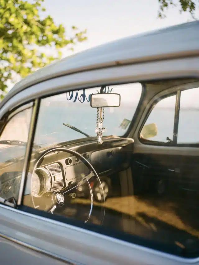 Looking in through the driver's side window into a vintage VW Beetle