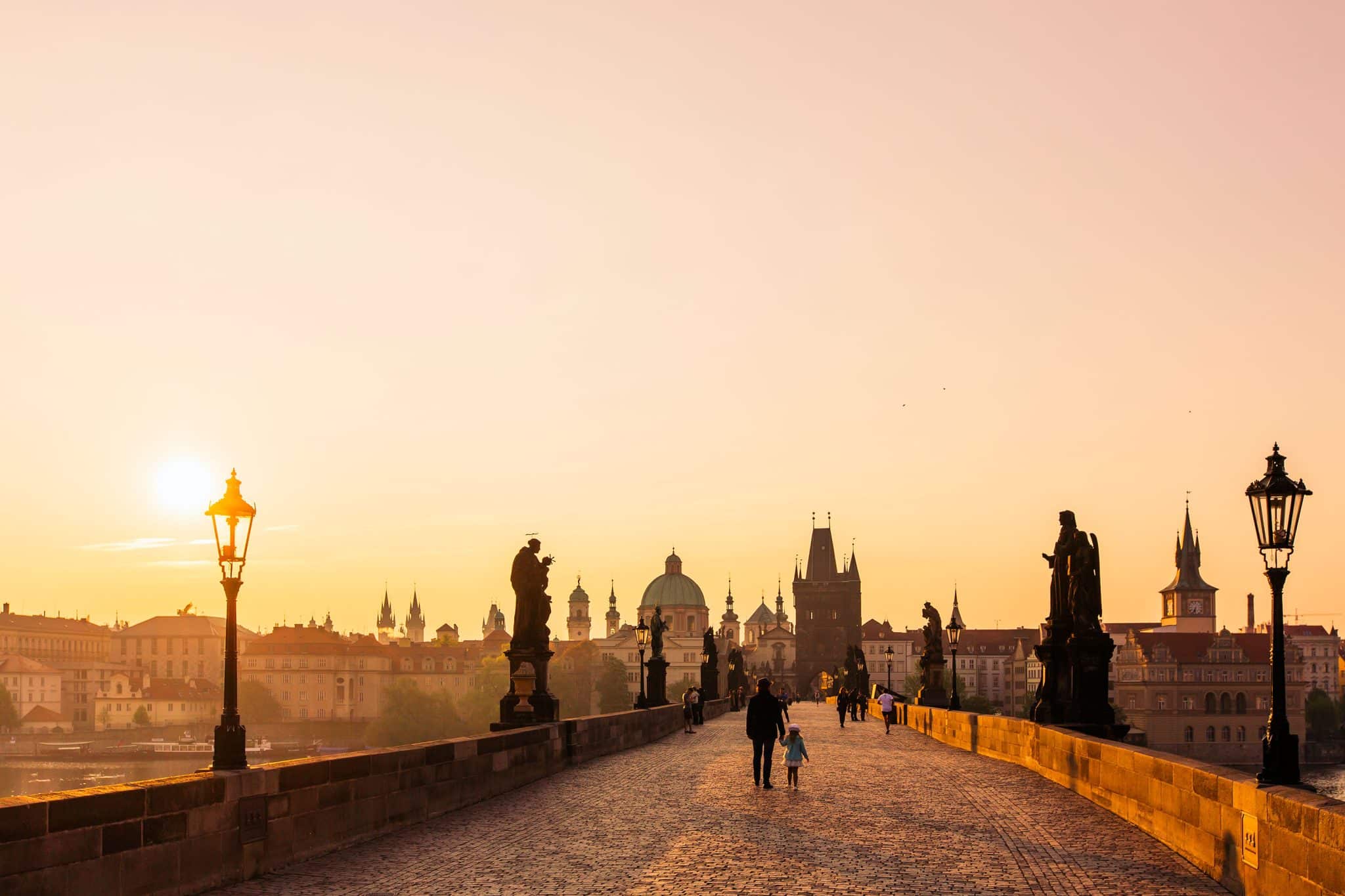 The Charles Bridge over the Vltava river, in Prague, lit