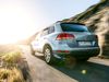 Back of car in motion along mountain pass.