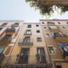 This multi-story building's bright exterior is in typical Catalan style