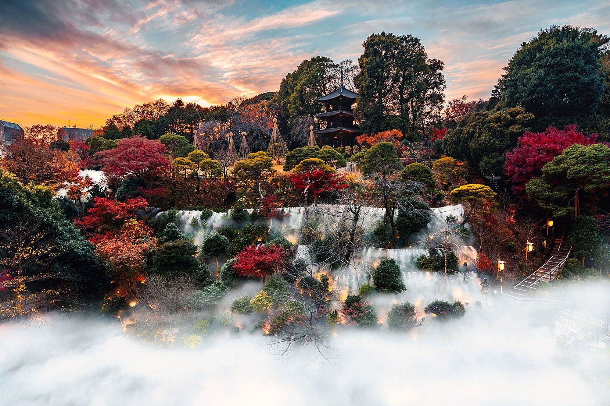 A waterfall cascading amidst trees and a tranquil pagoda backdrop.