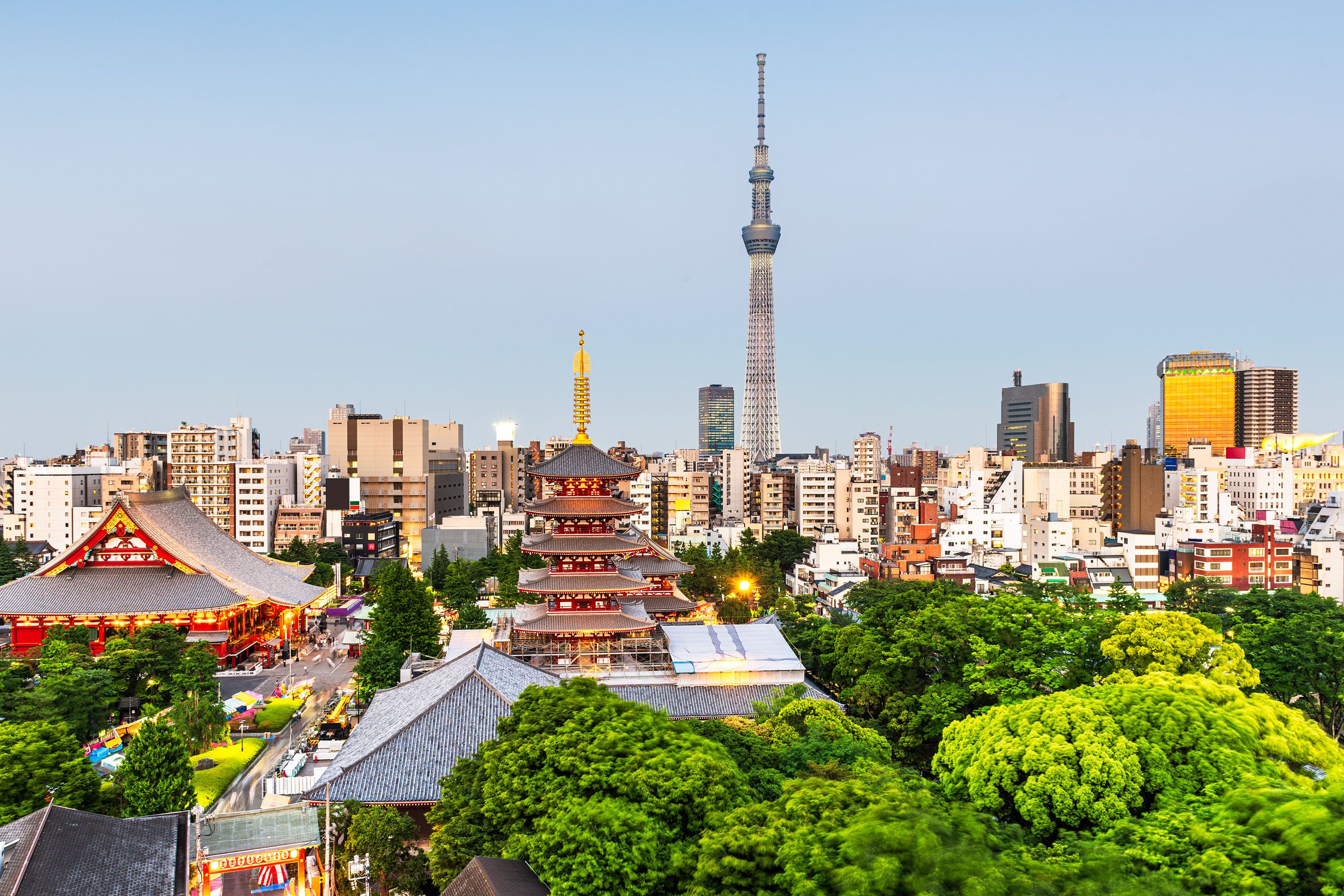 Tokyo Skytree tower in Tokyo, Japan, a tall lattice structure stretching skyward above city buildings.