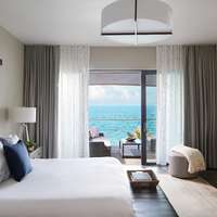 A room at The Loren at Pink Beach