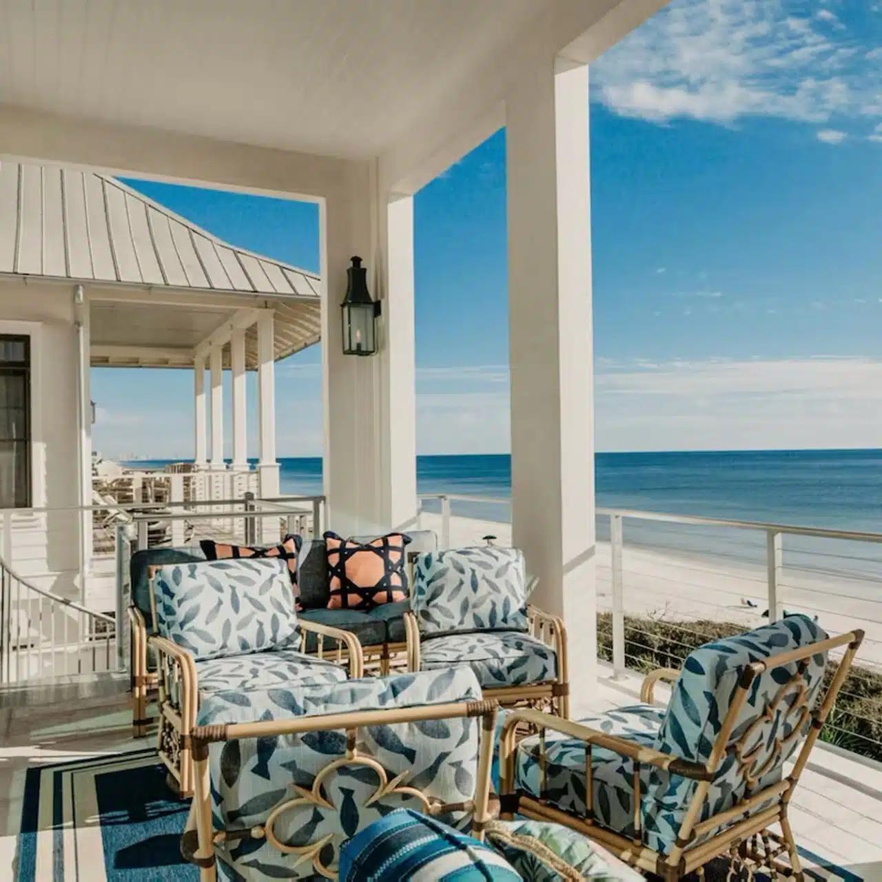 Comfy patterned furniture on a deck looking out at the Gulf Coast