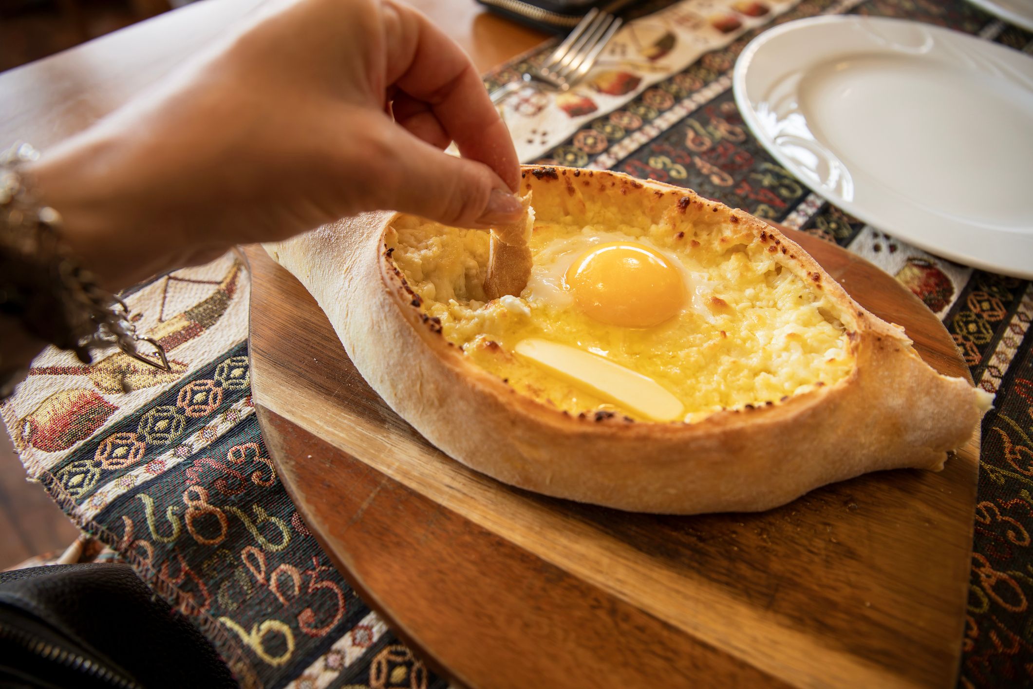 Khachapuri coming from oven.