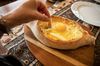 Khachapuri coming from oven.