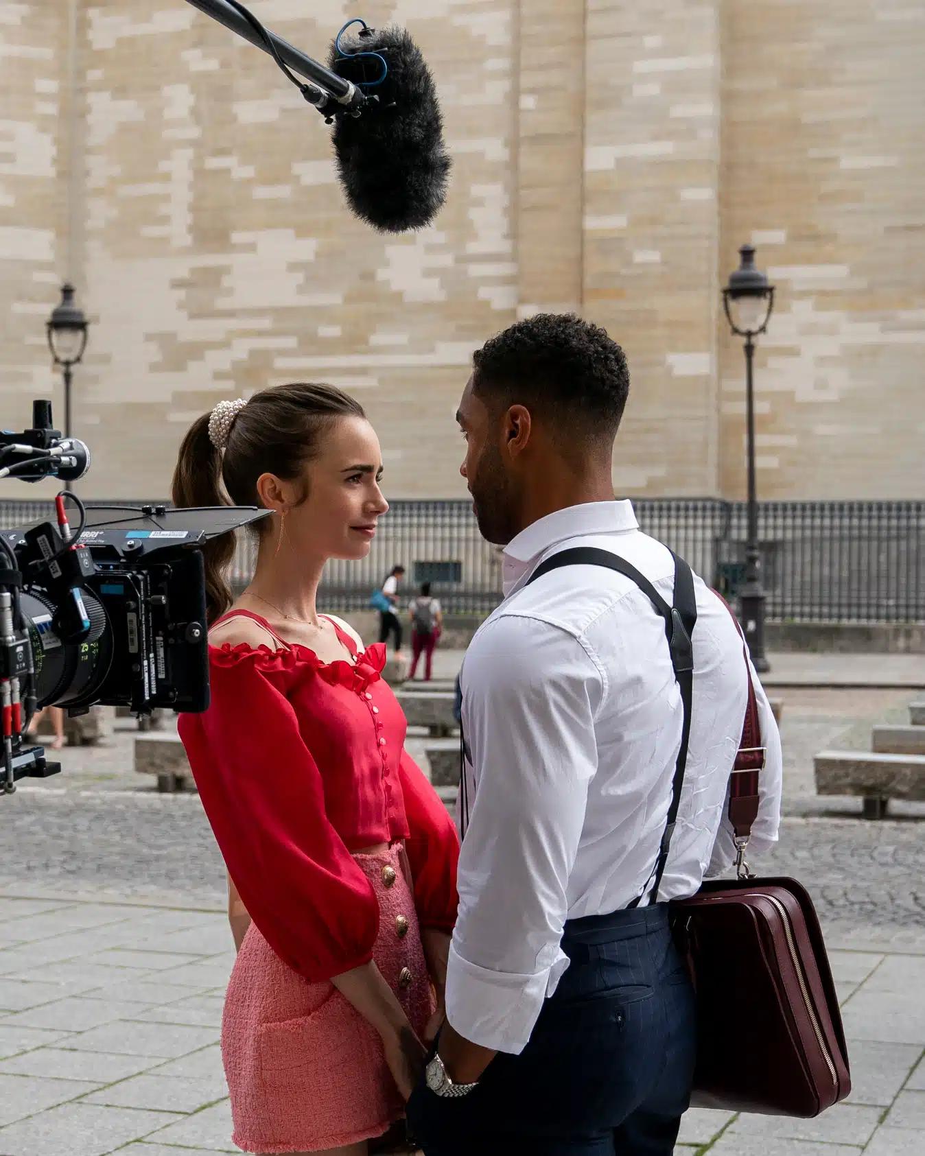 Lily Collins and Lucien Laviscount filming a scene for Emily in Paris 