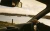 A view of islands, boats and the sea from a car driving Ireland's Wild Atlantic Way
