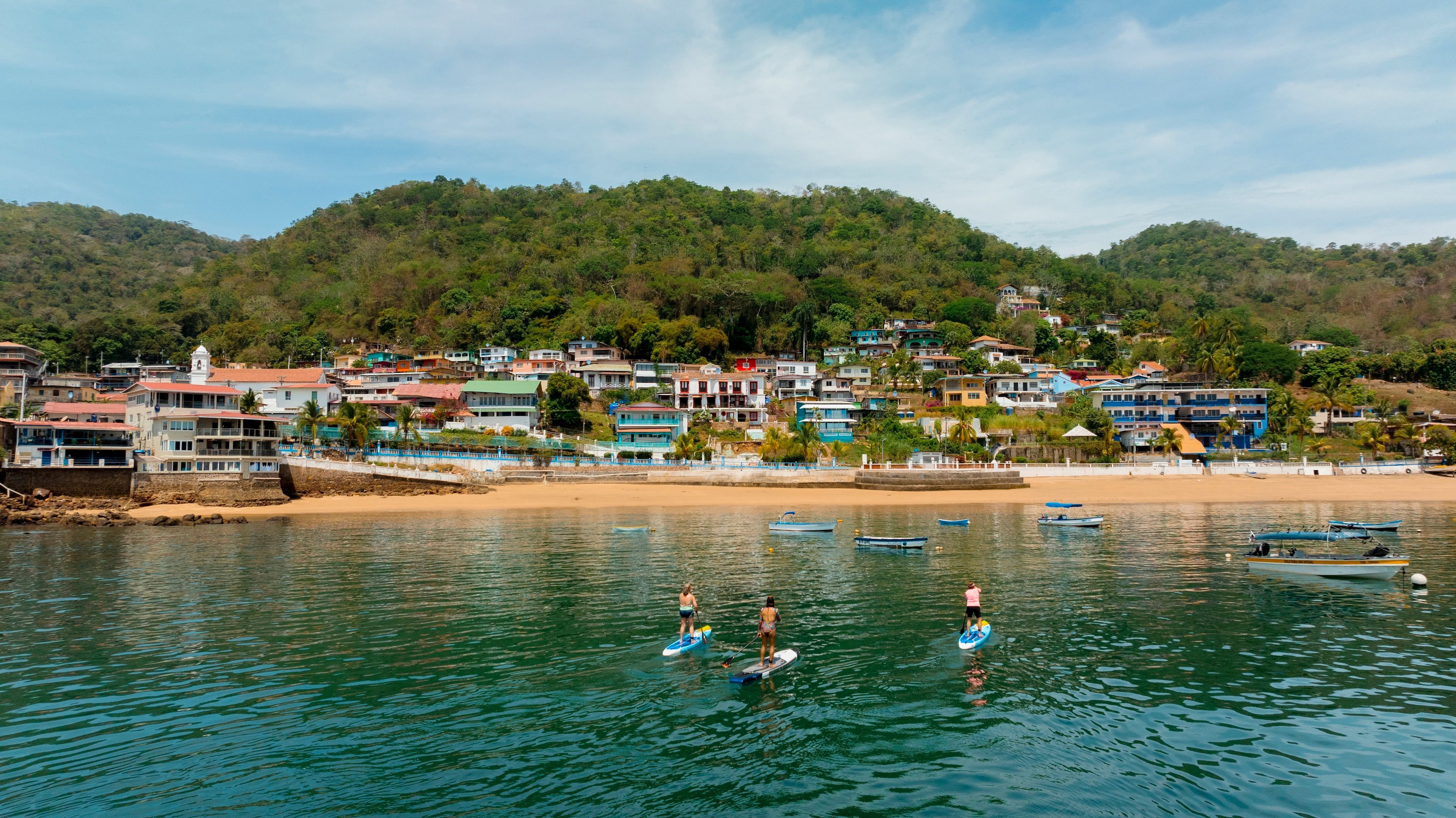 Paddleboarders in the sea off the coast of Isla Taboga, near to Panama City