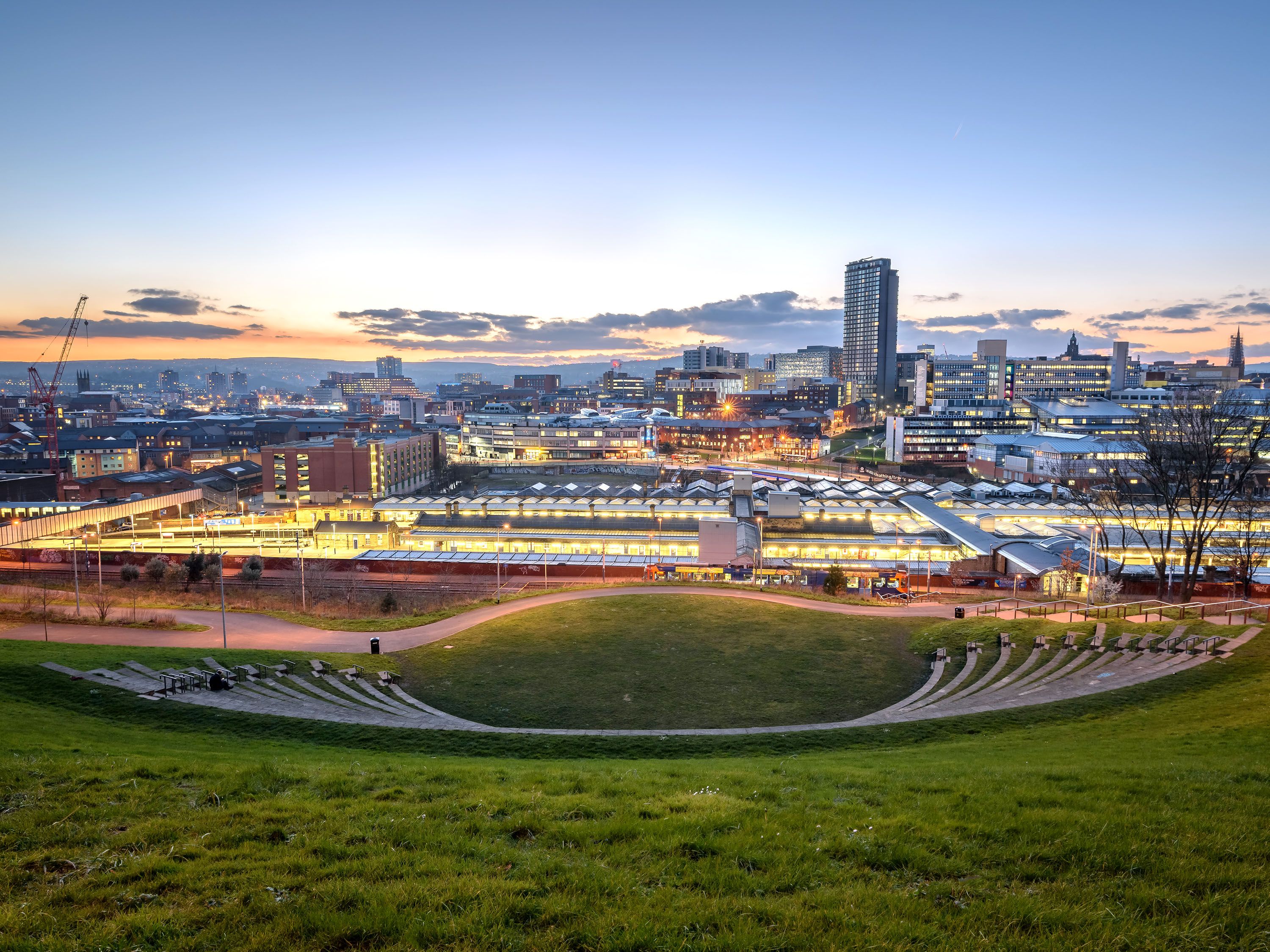 Outdoor ampitheater overlooking city.