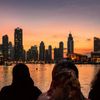 Dubai’s skyline lights up as the sun sets